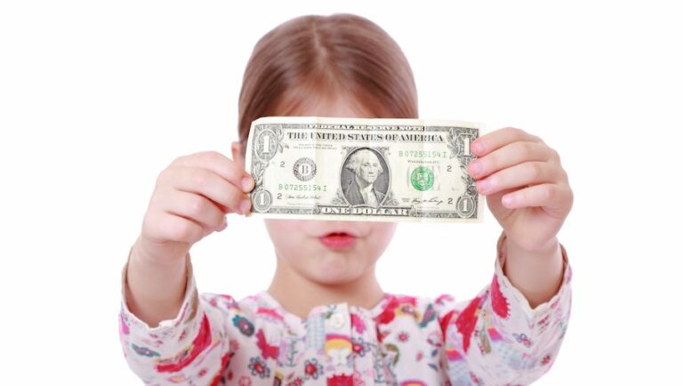 A girl with a dollar bill - teaching kids to budget their allowance