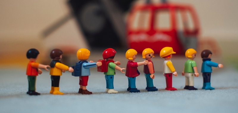 Lego People standing in a straight line - for kids to play with.