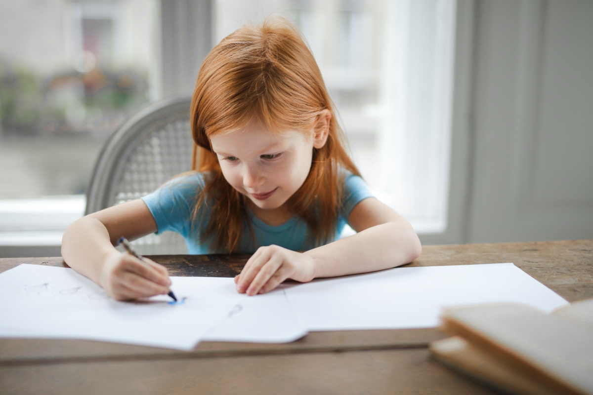 Young child coloring alone
